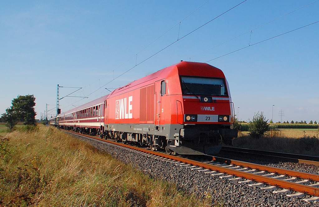 This photo shows an diesel  locomotive called Hercules.....it is owned by the WLE-companie( Westphalian County Railway/ Westfhlische Landes Eisenbahn) and carries the Nr. 23.......It's Classnumber is 223 057-1 and it pulls an chartertrain of privatecars from diverend companies......here is it near Allerheiligen on the tracks to Cologne. Sunday 9th. of septembre 2012