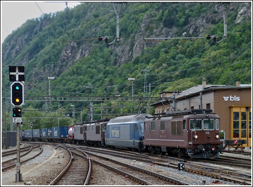 Three BLS Re 4/4 and one BLS Re 465 are hauling together a goods train through the station of Brig on May 22nd, 2012.