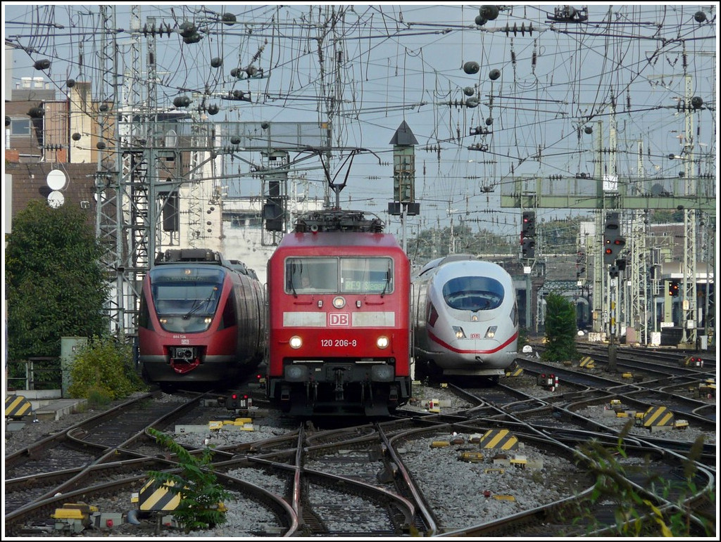 Three trains are entering in the same time into the main station of Cologne on September 19th, 2011.