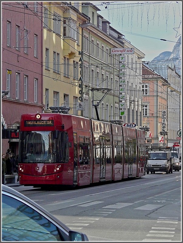 Tram 315 is running through the Museumsstrae at Innsbruck on December 22nd, 2009.