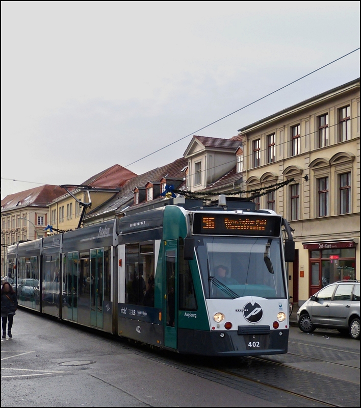 Tram N° 402 is running through Friedrich-Ebert-Straße in Potsdam on December 26th, 2012.