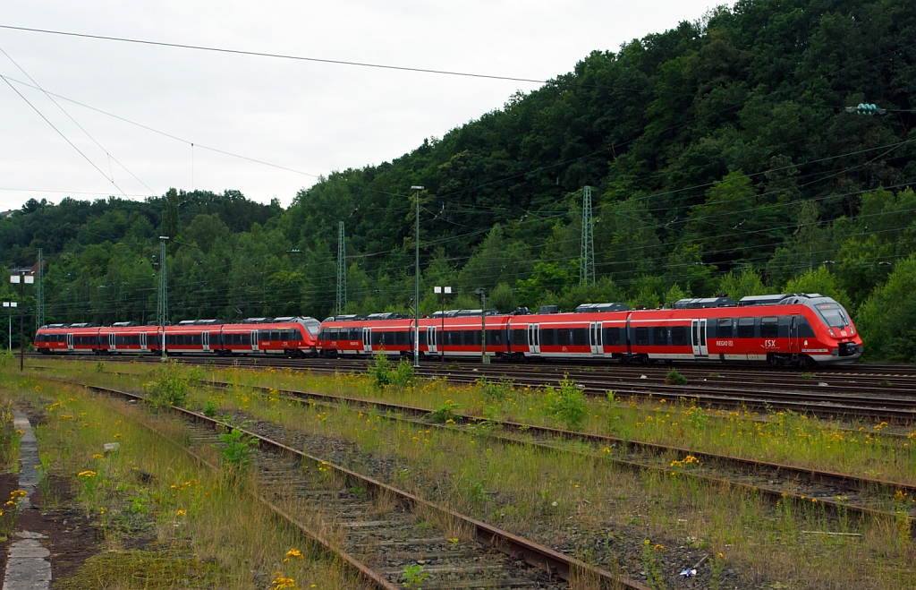 Two coupled 4 pieces  Talent 2  as RE 9 (rsx - Rhein-Sieg-Express) Siegen - Cologne -  Aachen runs on 11.07.2012 from Betzdorf (Sieg) in the direction of Cologne.