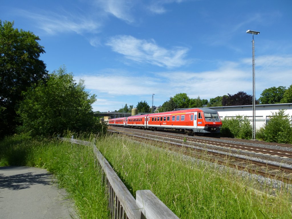 Two Diesel trains (BR 610) are driving by Oberkotzau on June 16th 2013.