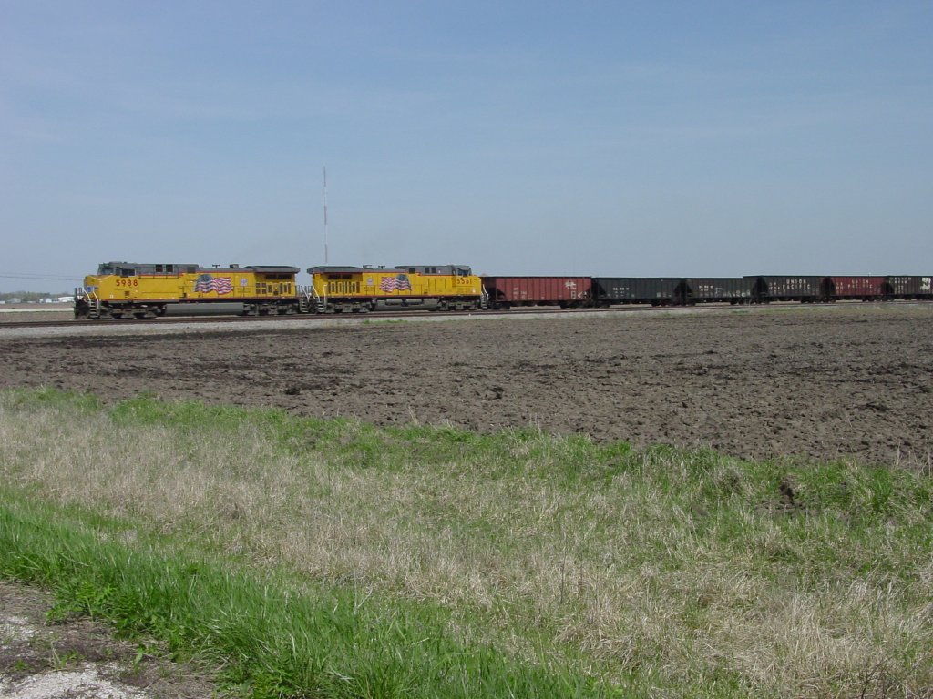 Union Pacific 5988 & 5561 pulls its empty coal train on the BNSF main line near Middletown, Iowa 15 Apr 2005.