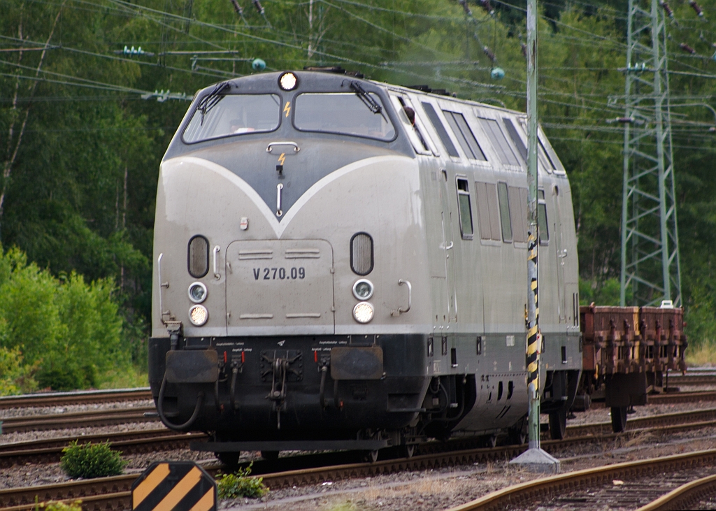 V270.09 of the SGL Schienen-Gter-Logistik  GmbH drives at the 17.07.2011 from Betzdorf / Sieg into the direction of Siegen. The locomotive was in 1964 by Krauss-Maffei in the serial number. 19 241, as V 200 121 (221 ​​121) built. It has a power of 2 x 990 kW (1346 hp respectively).