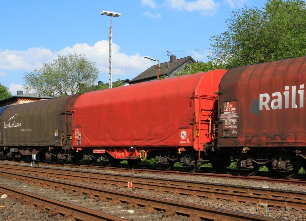 Wagon on bogies with four sets of wheels and sliding tarpaulin for coil transport (Shimmns-tu), of the DB AG (Germany)  on 17.05.2011 in Herdorf (Germany).