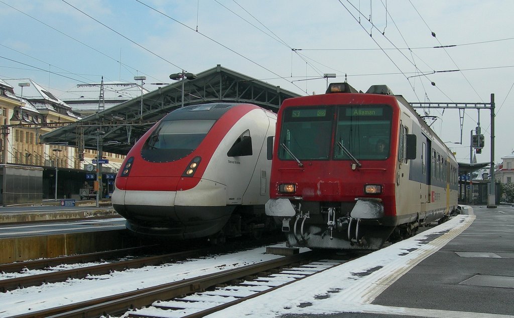 While the ICN to Basel waits the departure times the NPZ to Allaman is leaving Lausanne Station. 
18.12.2009