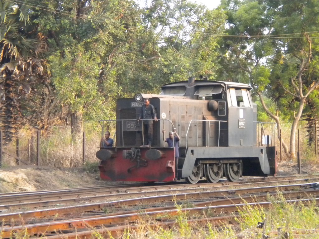 Y Class Shunter 697 slowly moving into the fuel depot with the shunt crew  to collect a rake of empty tanks at Anuradhapura in June 2012 .