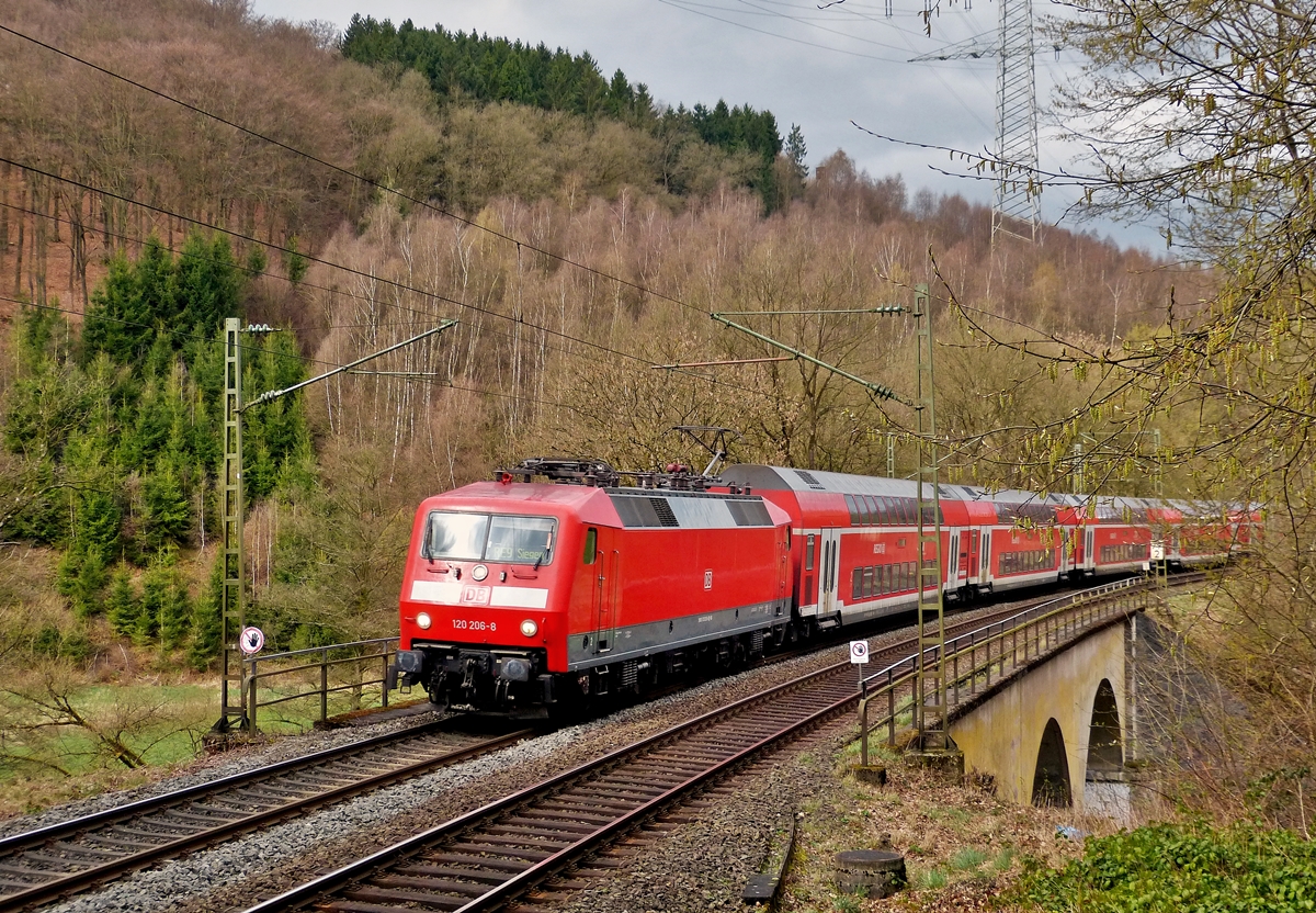 . 120 206-8 is heading the RE 9 (Rhein-Sieg-Express) Aachen - Siegen in Scheuerfeld/Sieg on March 22nd, 2014.