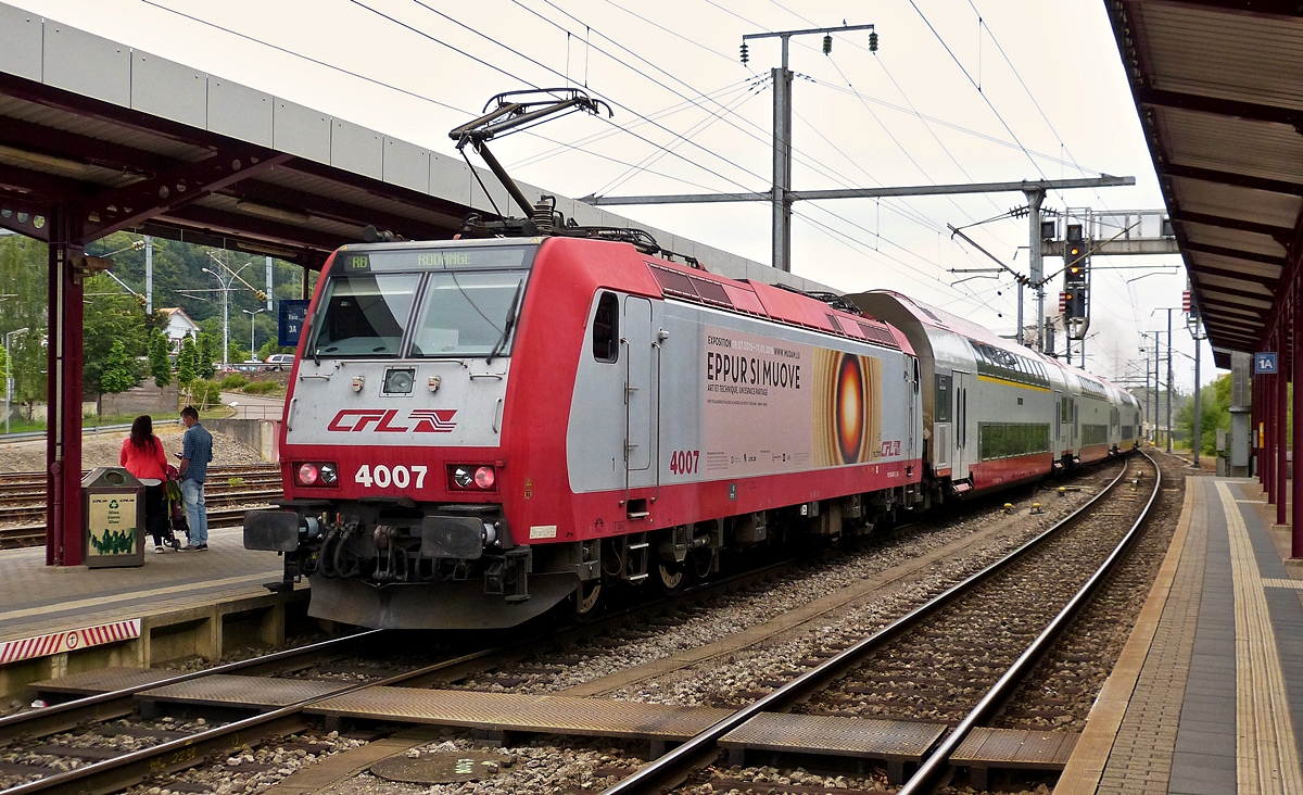 . 4007 is pushing its train out of the station of Pétange on July 26th, 2015.