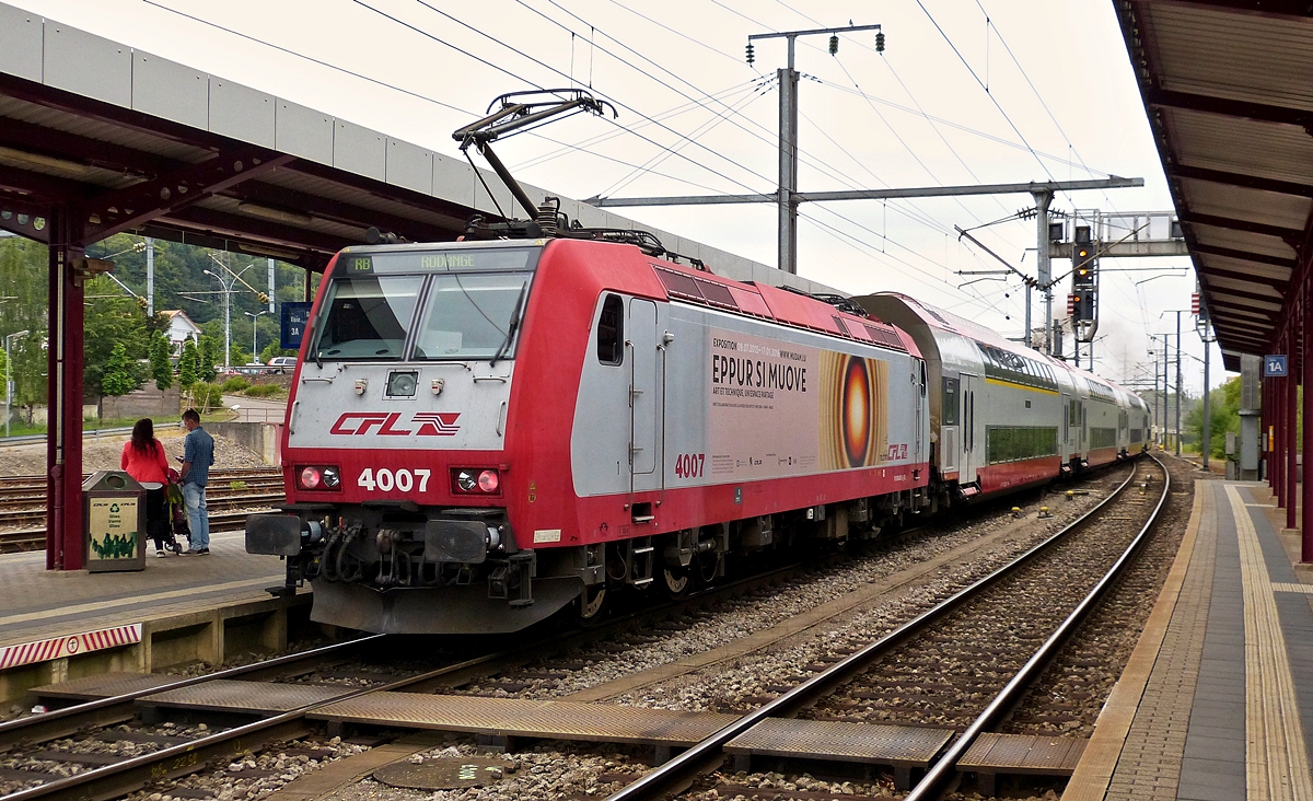 . 4007 is pushing its train out of the station of Ptange on July 26th, 2015.