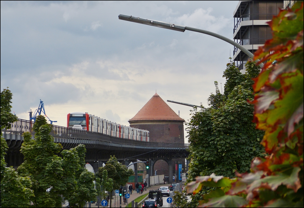 . A train of the Hamburger Hochbahn photographed just before arriving at the stop Baumwall on September 19th, 2013.