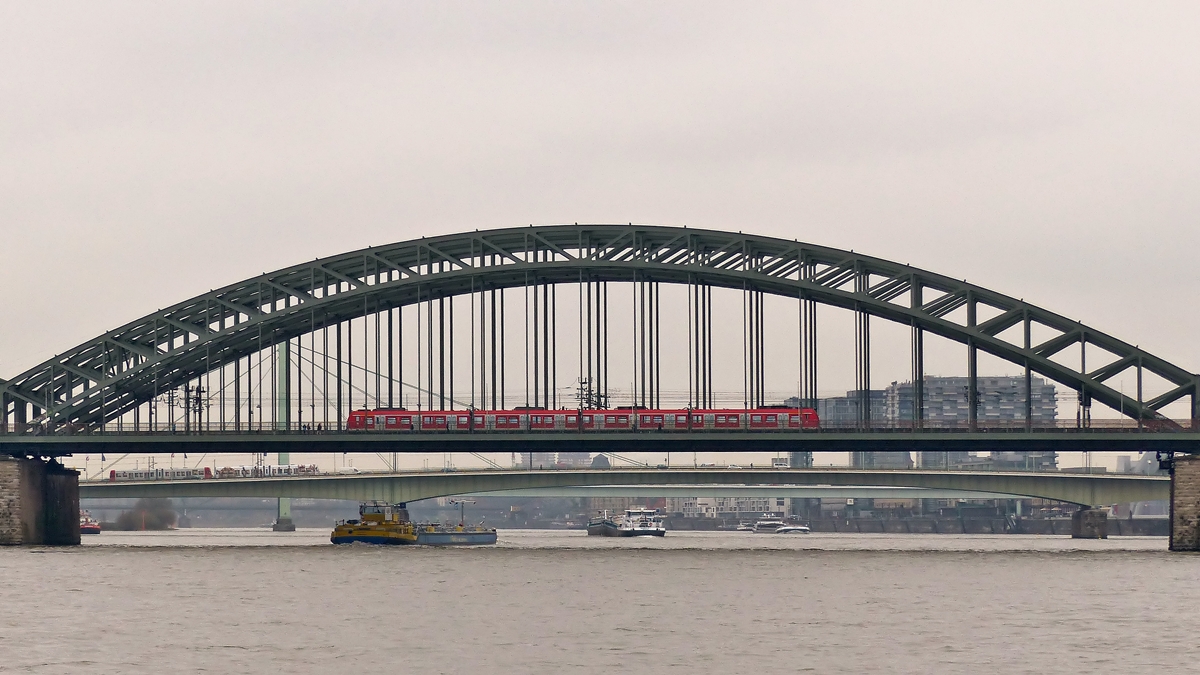 . A train of the Klner S-Bahn is running in the Hohenzollernbrcke in Cologne on November 20th, 2014.
