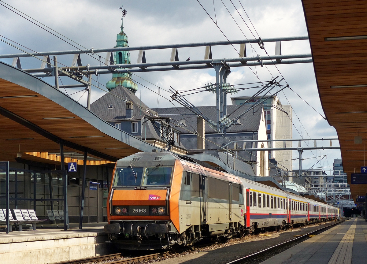. BB 26168 is heading the EC 91  Vauban  Bruxelles Midi - Basel in Luxembourg City on July 15th, 2014.