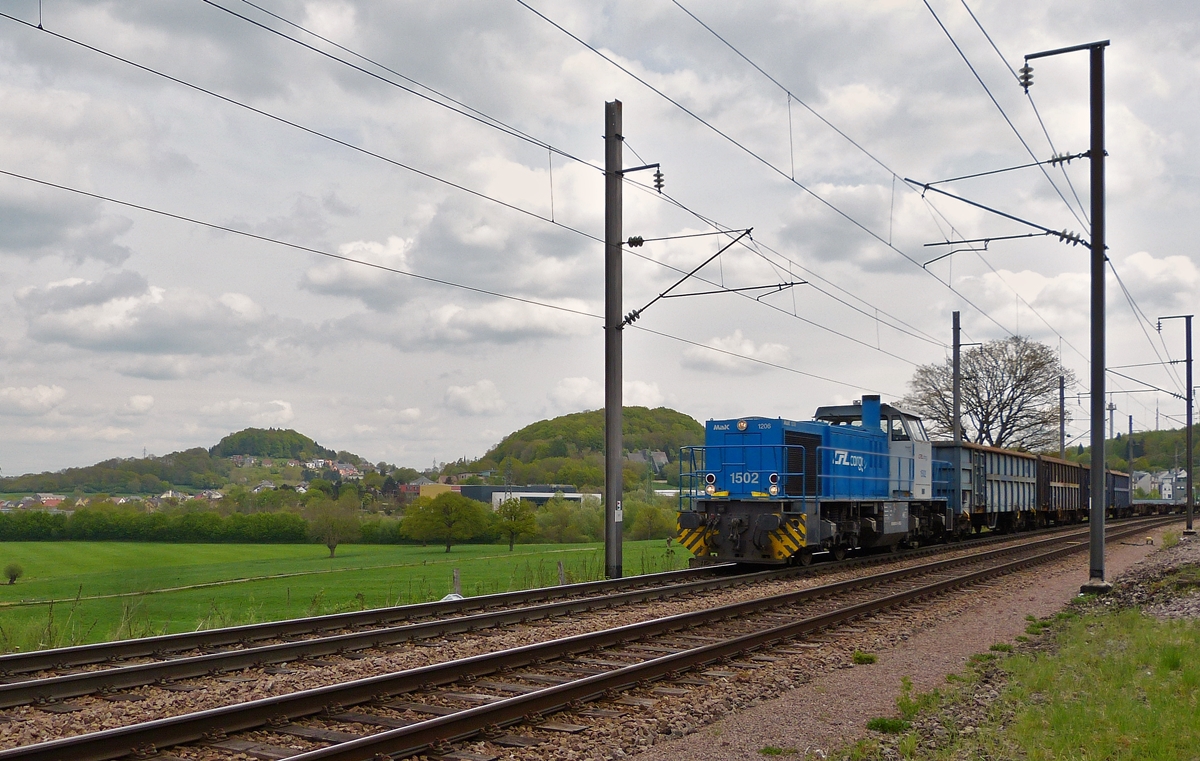 . CFL Cargo 1502 is hauling an empty freight train through Belvaux on April 29th, 2015.