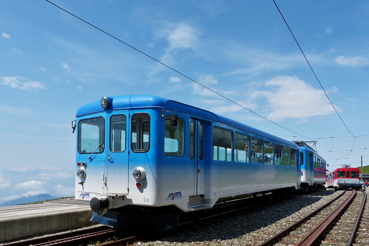 . Different Rigi Bahnen trains photographed in Rigi Kulm on May 24th, 2012.