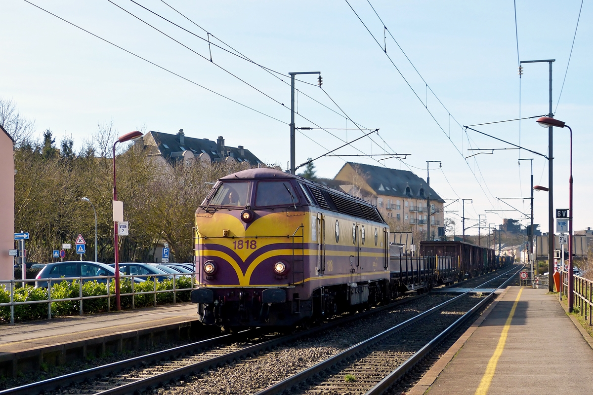 . The CFL Cargo 1818 is hauling a freight train through the station of Schifflange on February 24th, 2014.