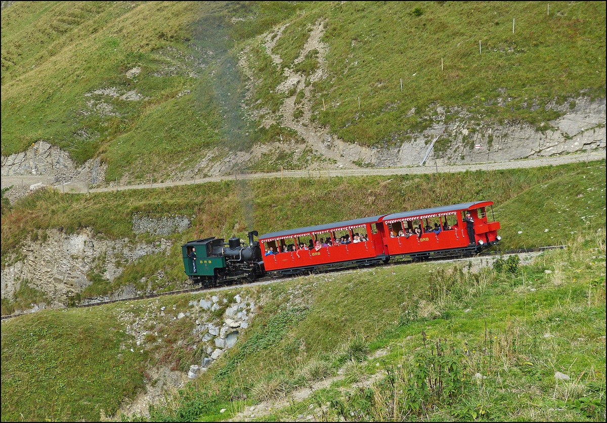 . The coal fired steam engine N 6 is pushing up its heritage cars B 16 and B 26 the BRB track just before arriving on the passing loop Oberstafel on September 28th, 2013.