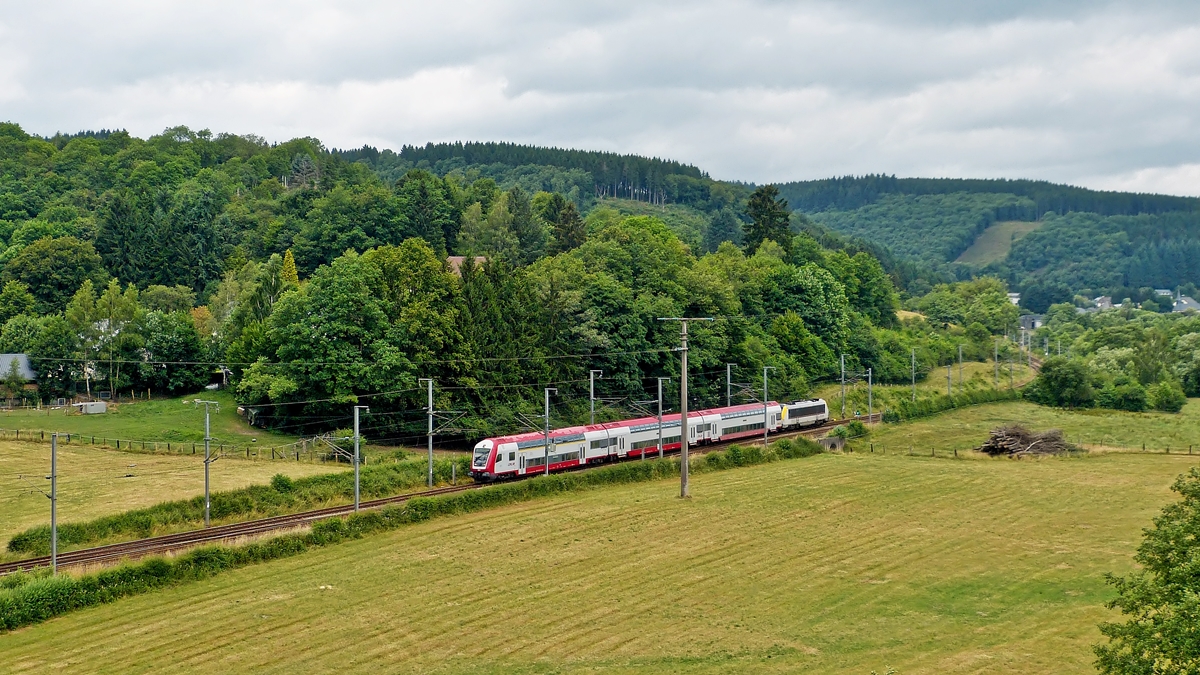 . The IR 3737 Troisvierges - Luxembourg City is running between Enscherange and Wilwerwiltz on July 6th, 2014.