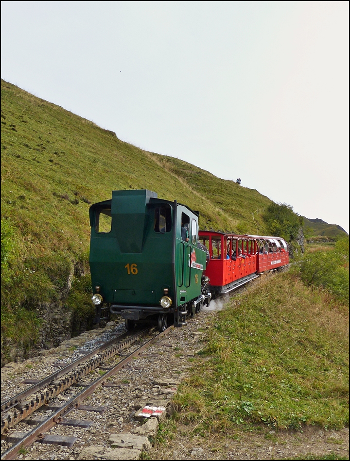 . The light oil fired BRB engine N 16 is pushing its cars towards the summit station Rothorn Kulm on September 28th, 2013.