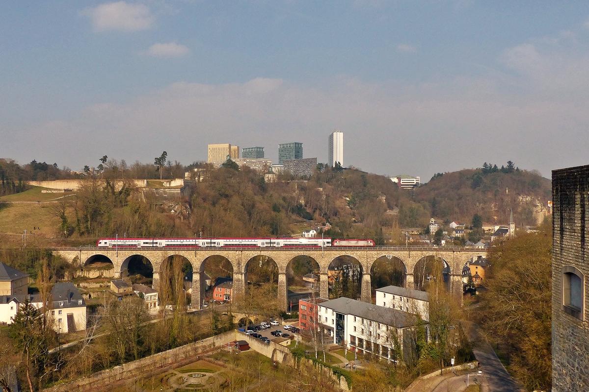. The RE 3814 Luxembourg City - Troisvierges is running on the Pfaffental viaduct in Luxembourg City on March 23rd, 2015.