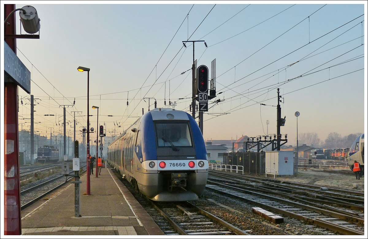 . The SNCF TER X 76660 is leaving the main station of Strasbourg on December 10th, 2013.