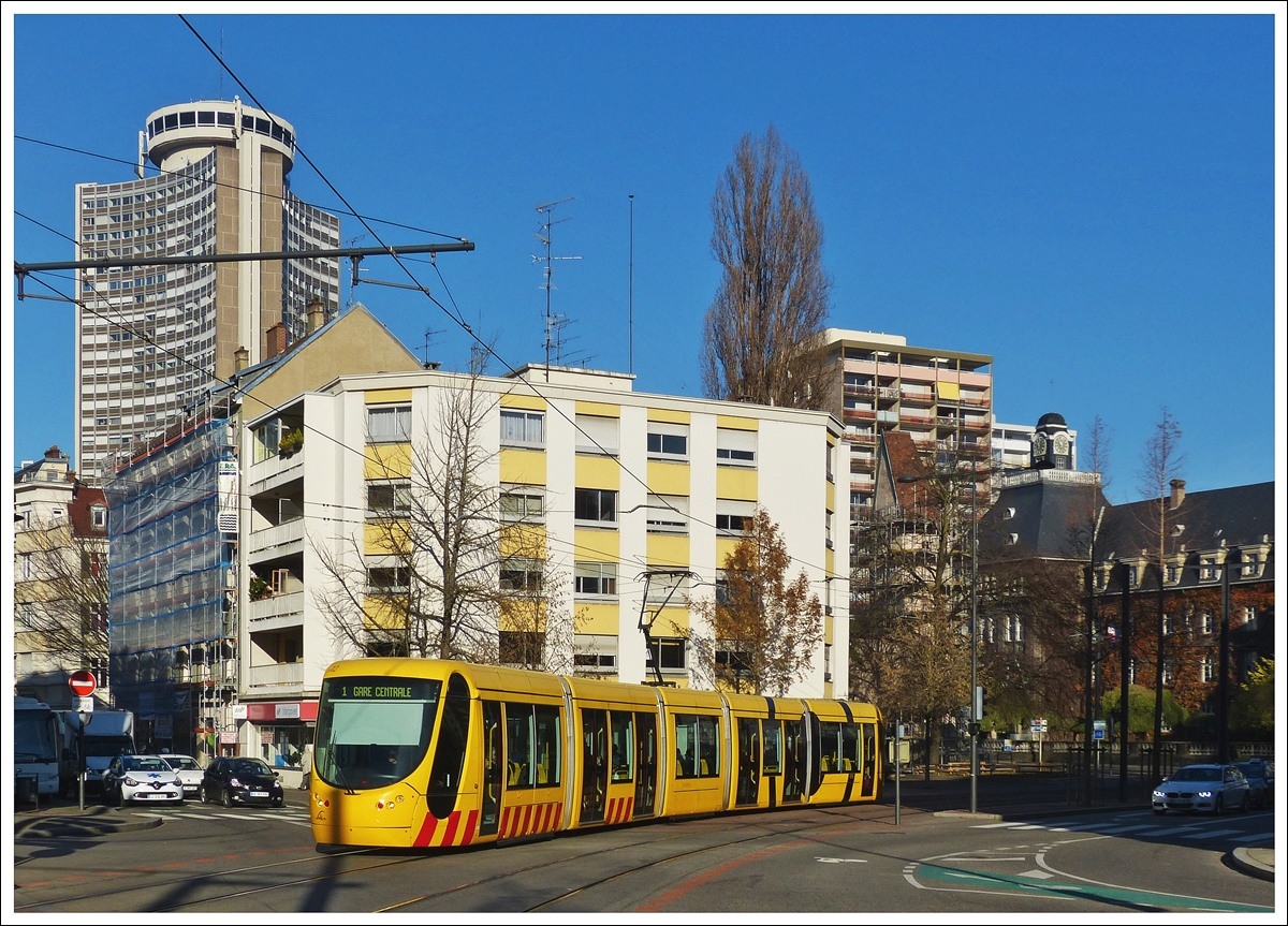 . The Sola Citadis 302 N 2012 is running through rue Louis Pasteur in Mulhouse on December 10th, 2013.
