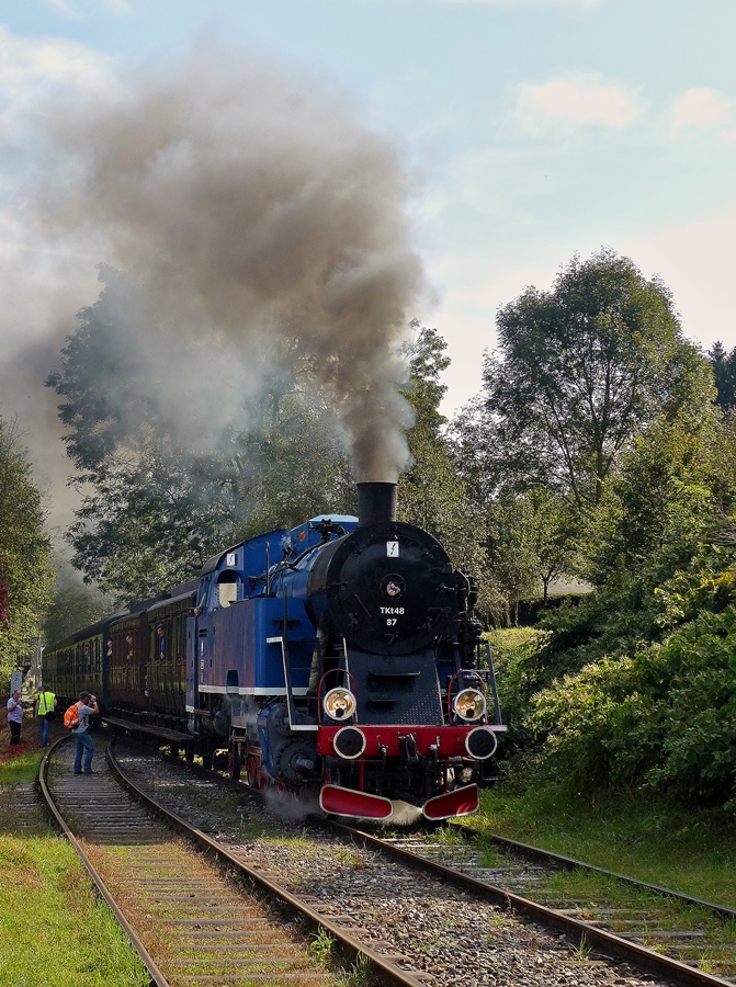 . The steam locomotive Tkt 48-87 of the heritage railway CFV3V (Chemin de Fer à Vapeur des 3 Vallées) is entering into the station of Olloy-sur-Viroin on September 28th, 2014.