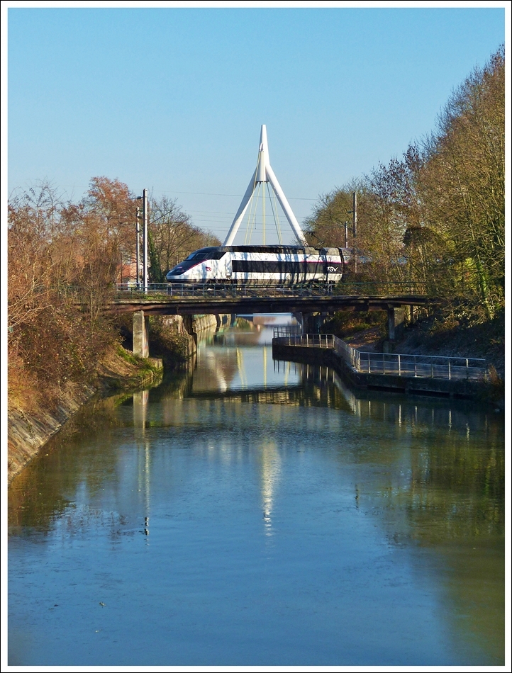 . The TGV 4513 is running on the bridge over the Canal du Rhne au Rhin just before arriving in the main station of Mulhouse on December 11th, 2013.