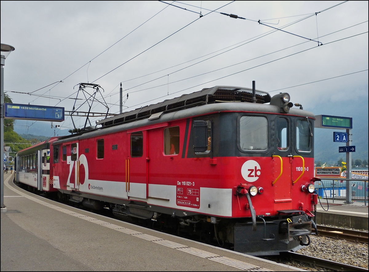 . The ZB (Zentralbahn) De 110 021-3 is hauling the Golden Pass train out of the station of Brienz on September 29th, 2013.