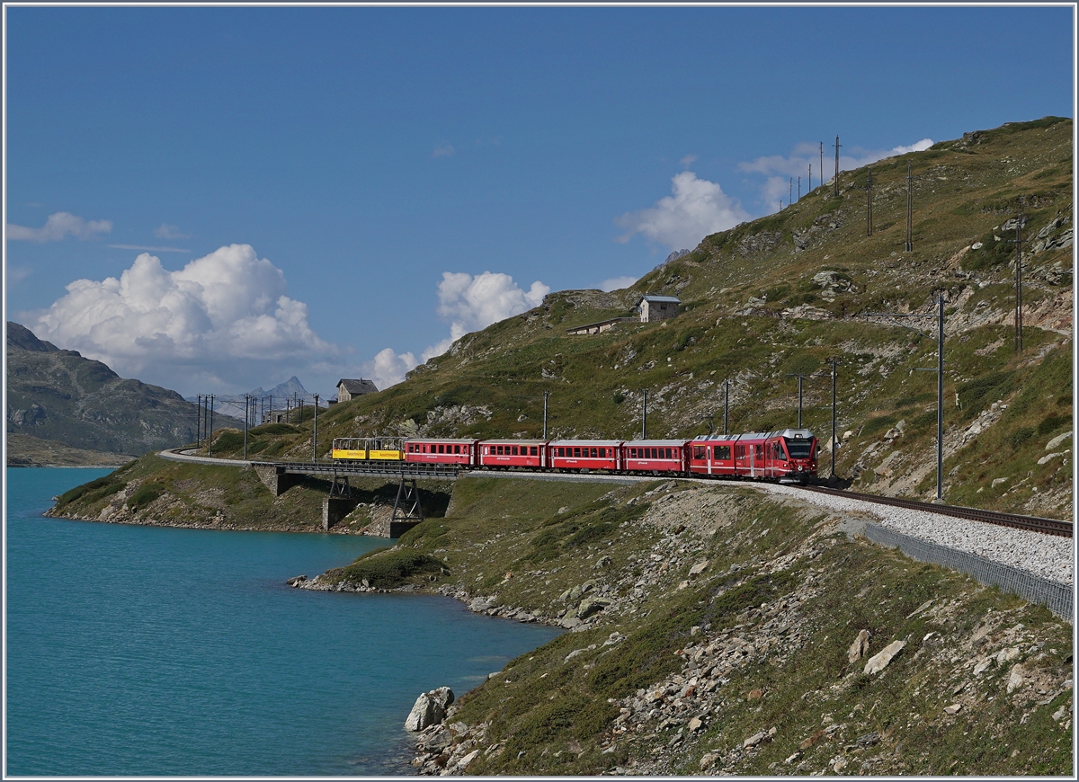 A Bernina Bahn local service on the way from St Moritz to Tirano by the Lago Bianco near the Bernina Osppizio.

13.09.2016