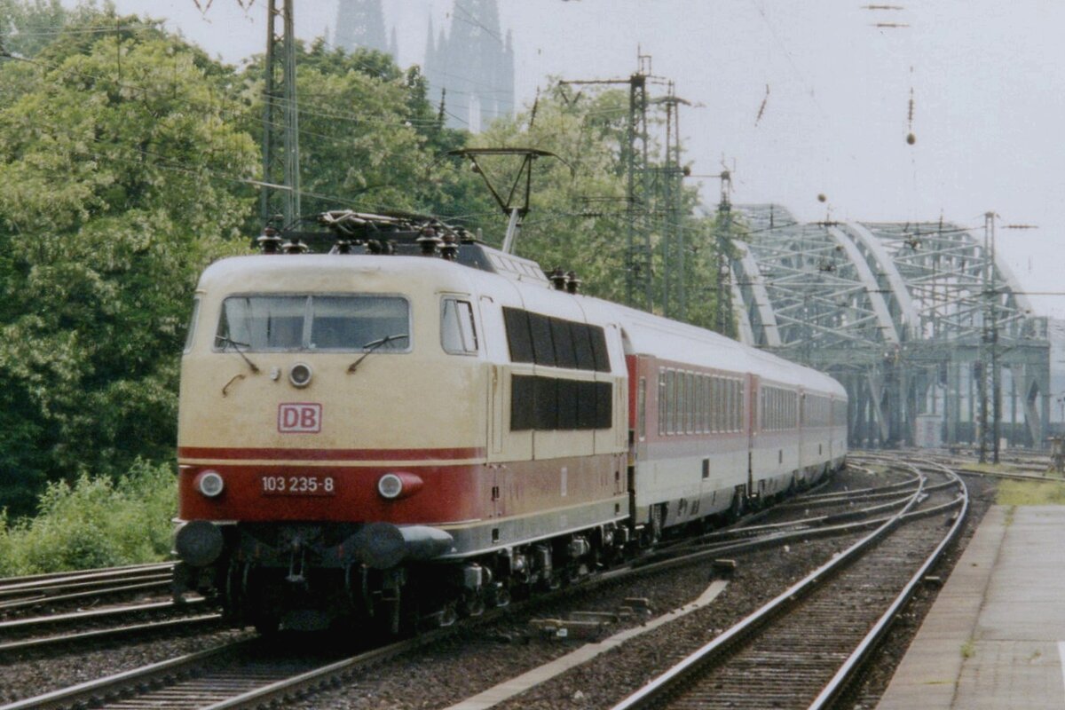 A bit against the Sun light: 103 235 hauls empty stock of an IC through Köln Deutz on 21 May 2005 -one of the very last deployments of Class 103 in normal DB service in the Köln area.
