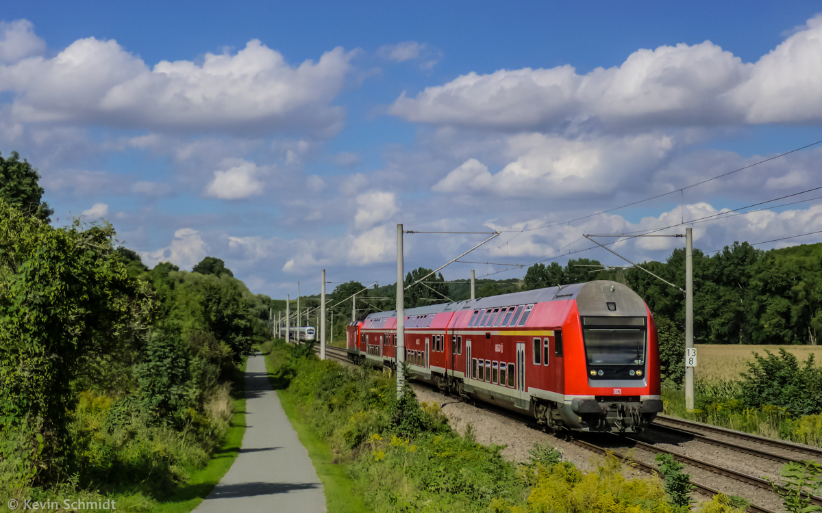 A double decker control unit series DABbuzfa 778 is at the head of a local train from Naumburg to Saalfeld and will shortly reach the station of Dornburg. (16 May 2013)