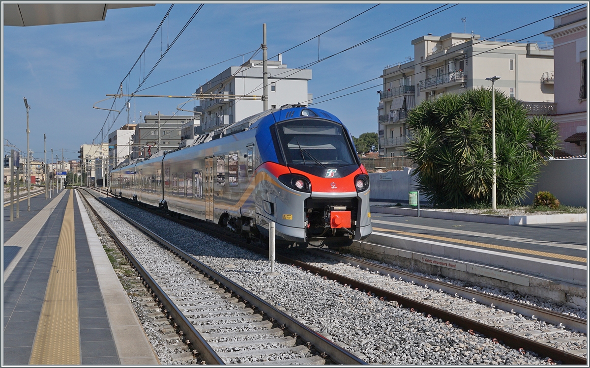 A FS Trenitalia 103  PoP  is the FS Trenitalia service 4316 from Bari (dp 0:35)  to Foggia (ar 10:16). This train is leaving Trani.

22.04.2022