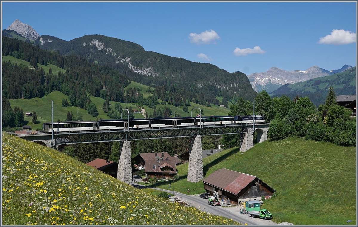A MOB Ge 4/4 wiht a MOB Service from Montreux to Zweismmen on the Gruben Viadukt by Gstaad.

02.06.2020