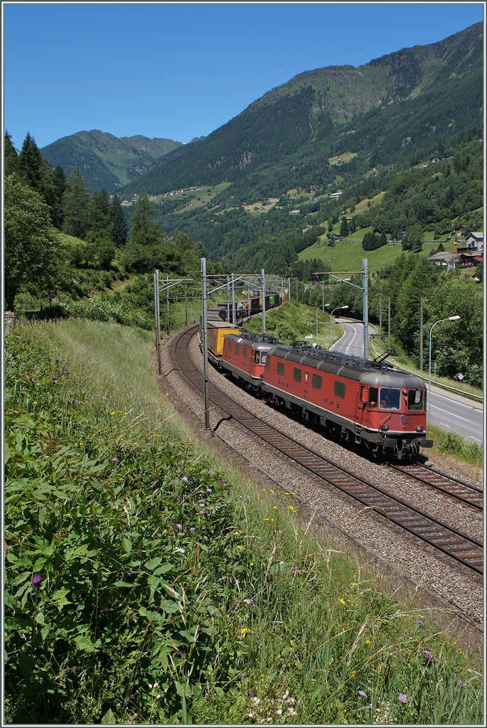 A Re 6/6 and a Re 4/4 II with a Cargo train near Rodi Fiesso. 
24.06.2015