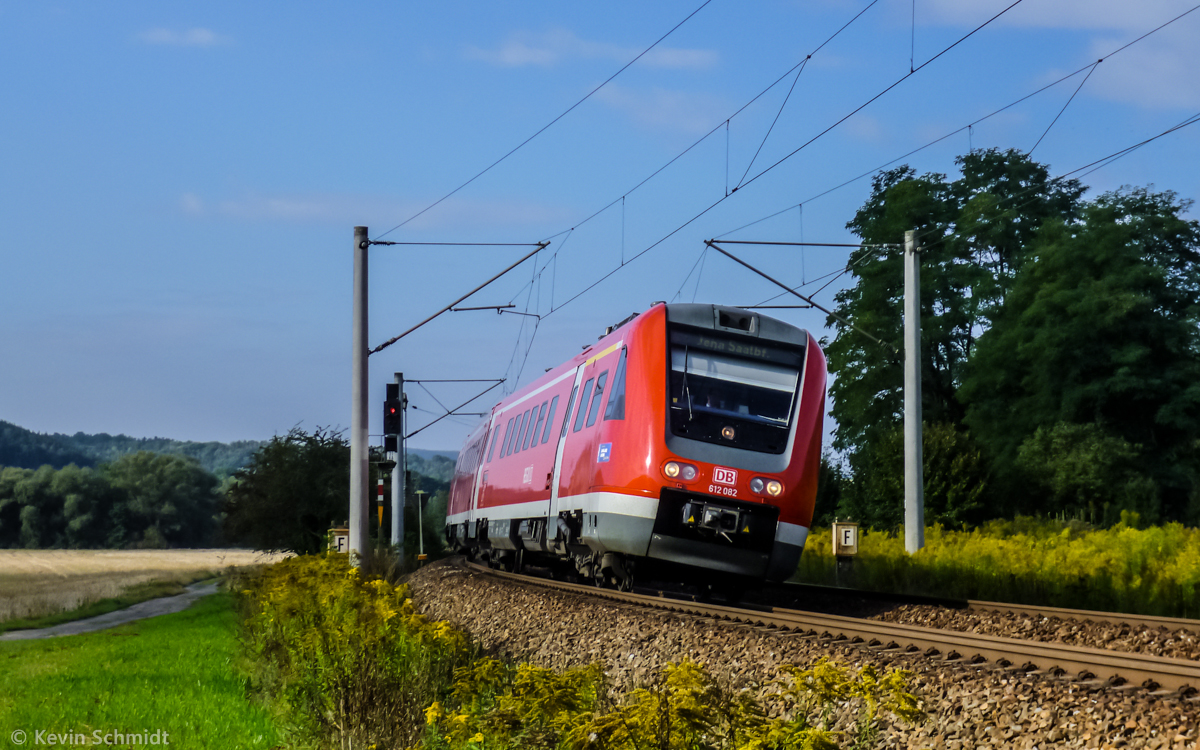 A regional express train from Lichtenfels to Jena with dmu series 612 082 is in tilting action at fast ride through a left turn near Orlamuende. (8 September 2012)