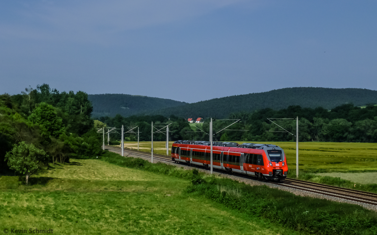 A regional express train with emu series 442 274, called 'Talent 2', is on the ride through the Saale river valley from Jena to Nuremberg and will shortly arrive in Kahla. (17 June 2013)