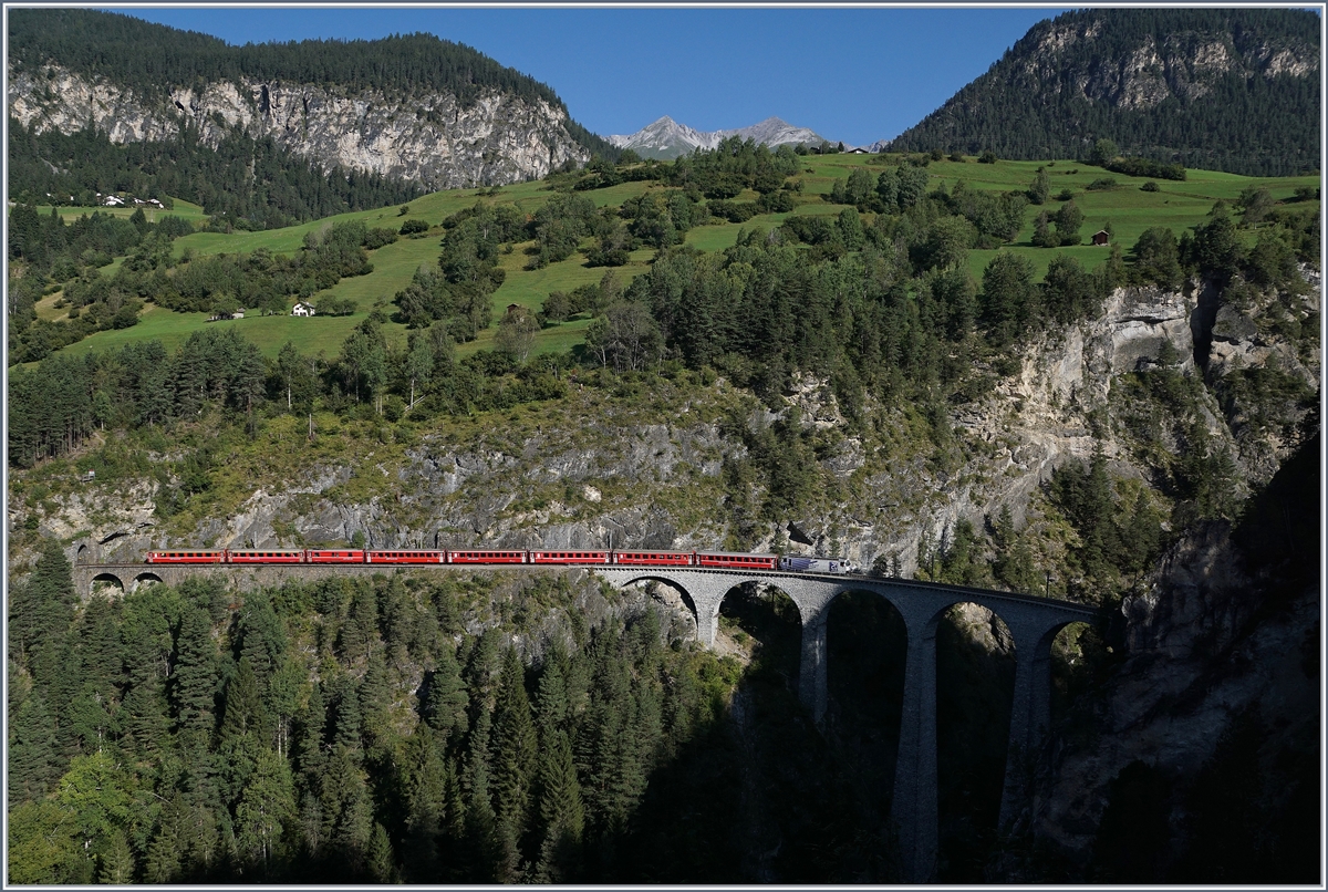 A RhB Ge 4/4 III 649  20 Minuten  with his Albula Fast-Serice from Chur to St Moritz by Filisur on the Landwasser Viaduct.
 
12.09.2016