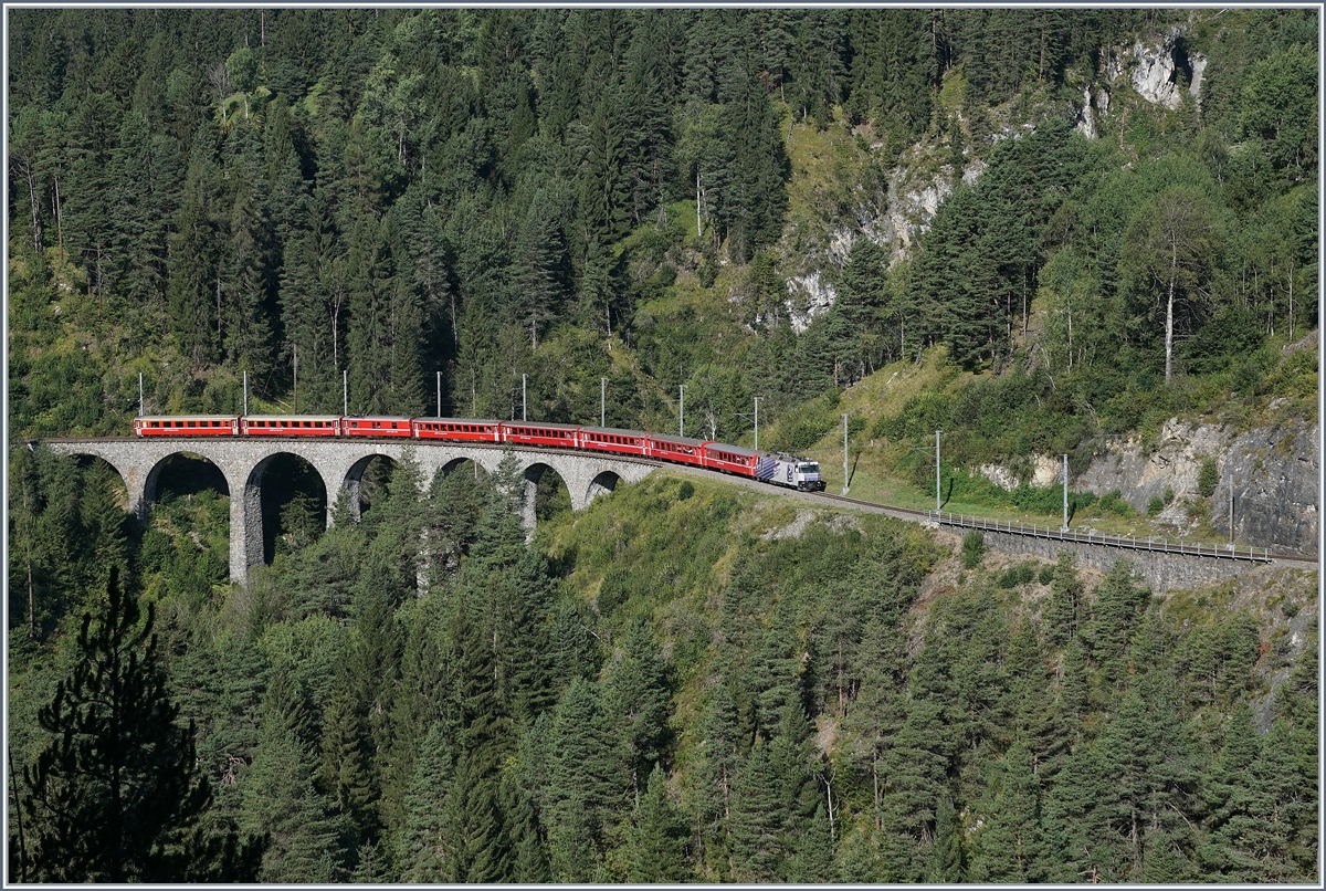 A RhB Ge 4/4 III wiht a  Albula  fast train Service near Filisur on the way to St Moritz.

12.09.2016