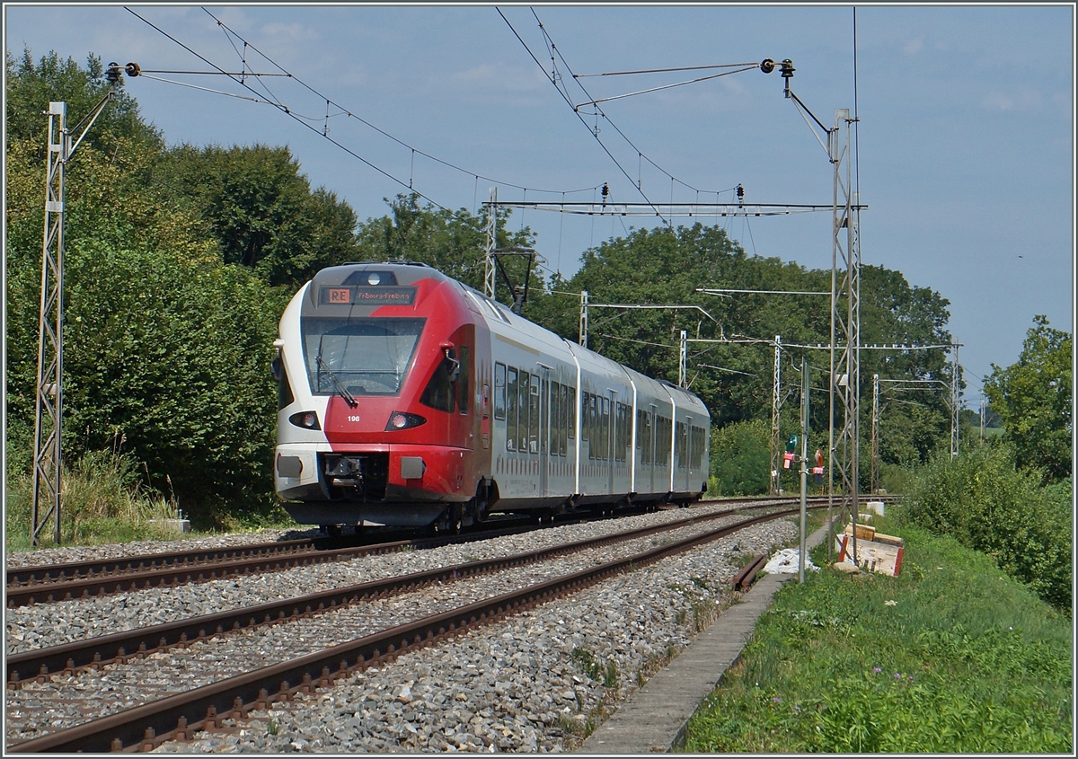 A TPF RABe 527 on the way to Fribourg between Neyruz and Rosé. 
06.08.2015