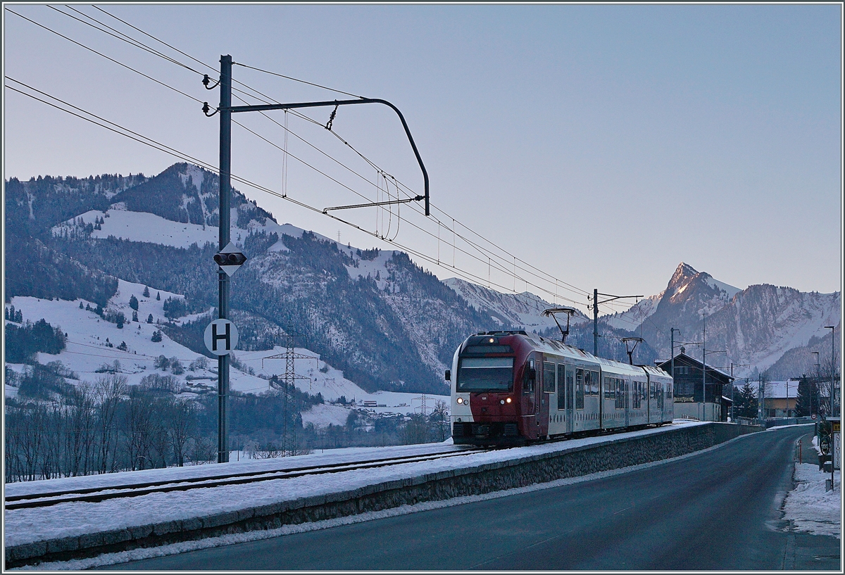 A TPF SURF Abe 2/4 B Be 2/4 on the way to Bulle in the cold shado of the glen by Nerivue. 

11.01.2021