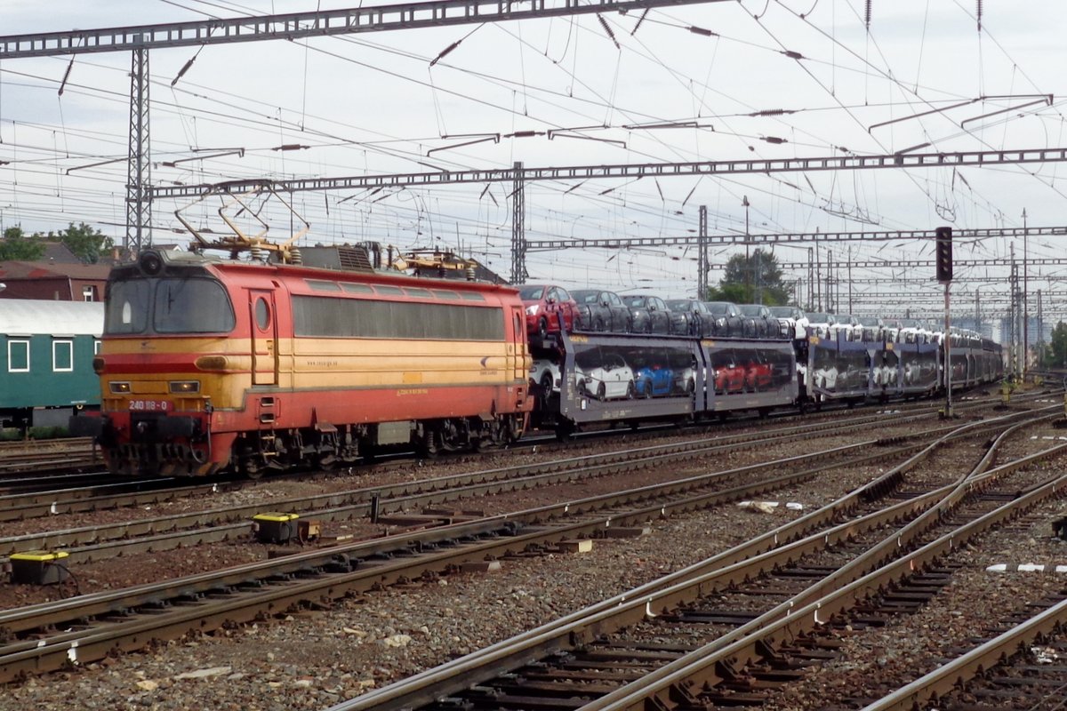 A train with automotives is hauled by 240 118 through Bratislava hl.st. on 22 September 2017.