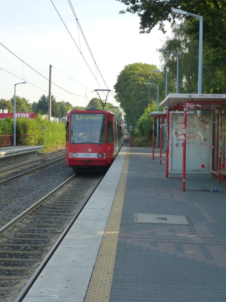 A tram (Line 18 to Buchheim) is leaving the station  Efferen . Cologne on August 21st 2013.