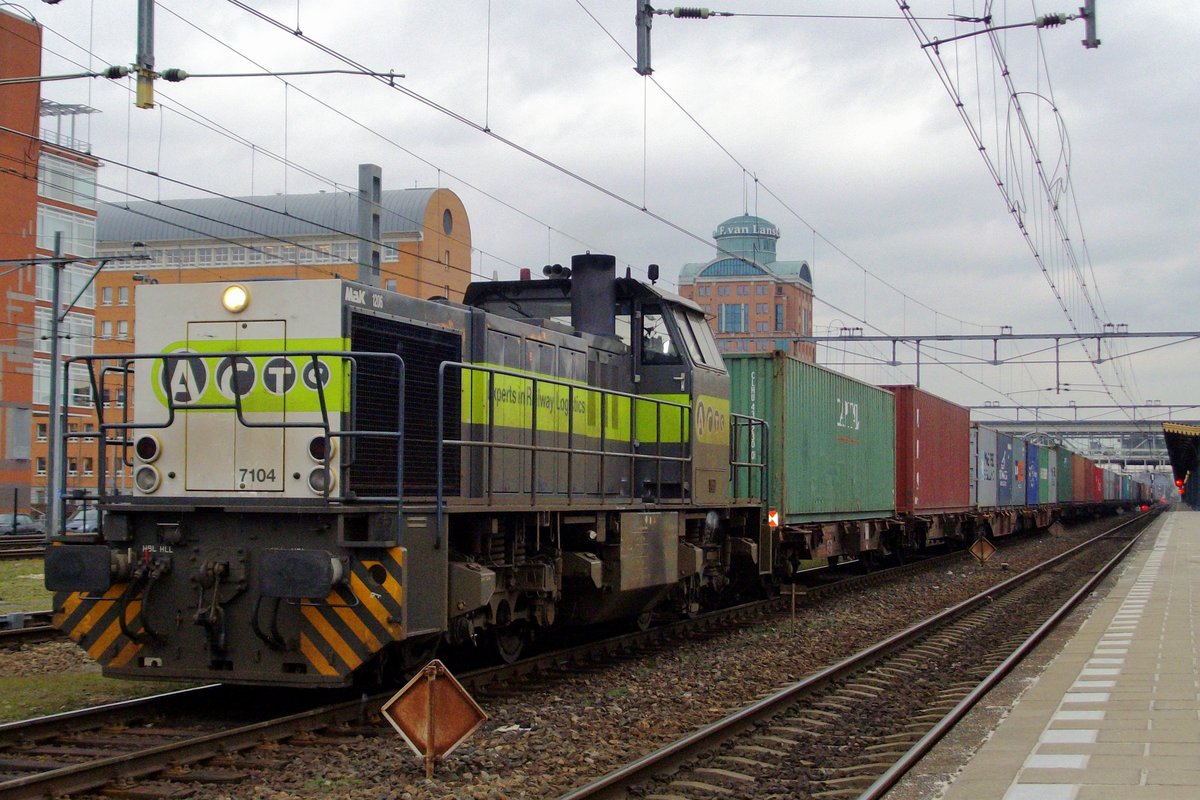 ACTS 7104 stands with the Acht-shuttle container train into 's-Hertogenbosch on 22 February 2005. Normally this train shuttles between Acht and Tilburg via Boxtel, but since that direct way was blocked due to an accident, the train had to be diverted, necessitating a  change of direction at 's-Hertogenbosch.