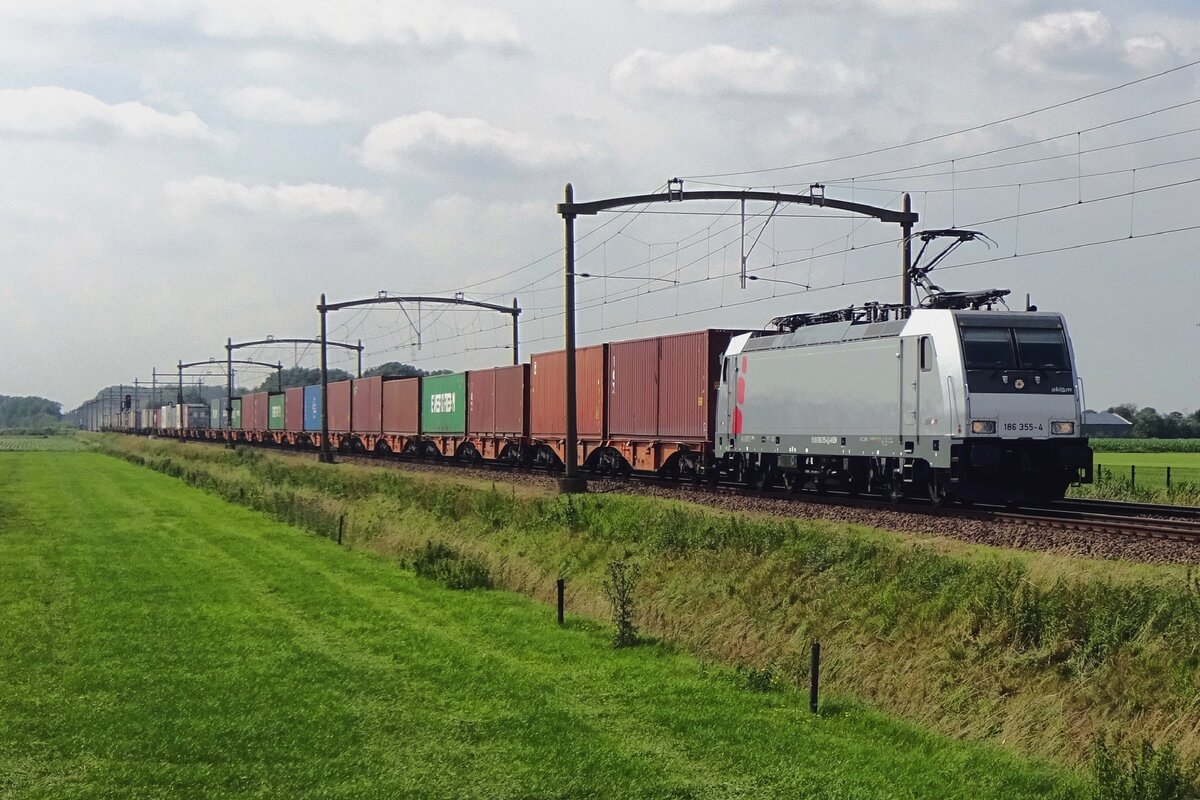 Akiem 186 355 hauls a container train through Hulten on 9 July 2021.