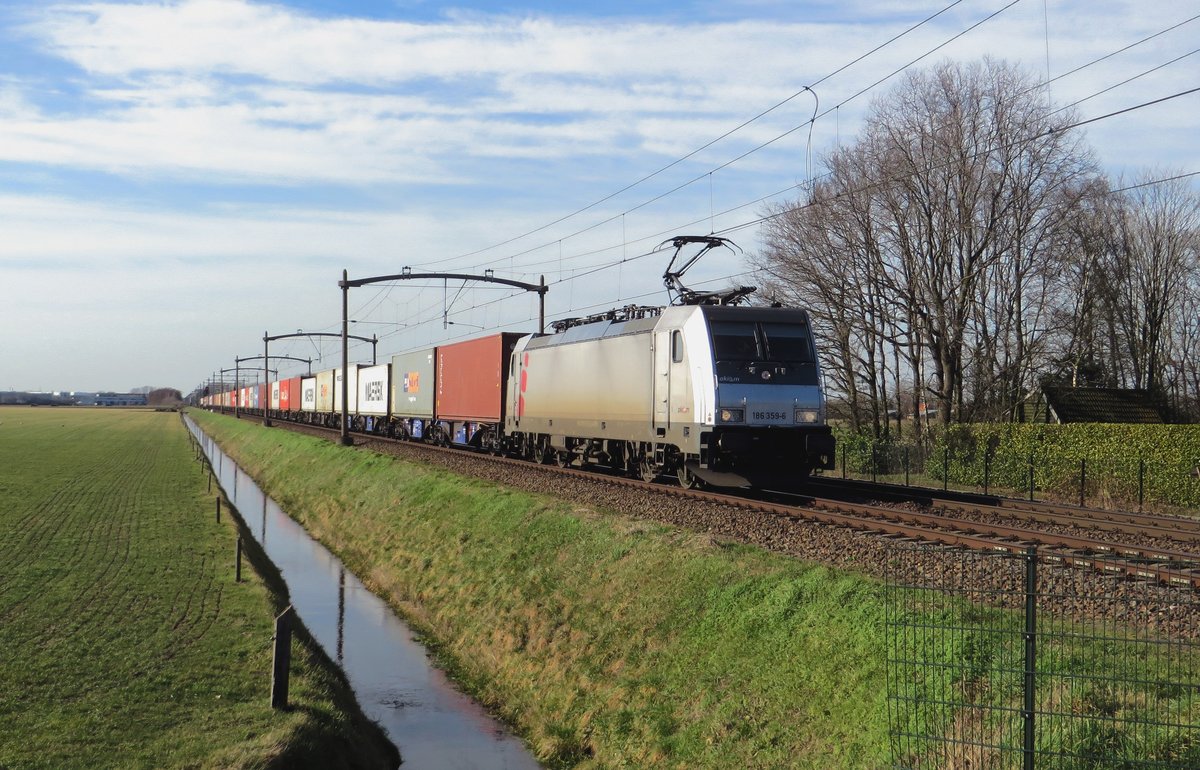 Akiem 186 359 hauls a container train through Hulten on 21 February 2021.