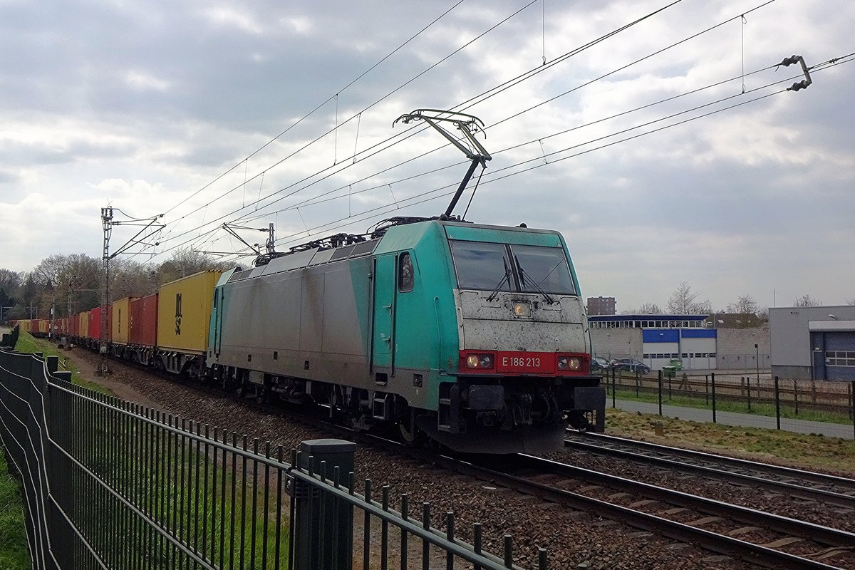 Alpha Trains 186 213 hauls a container train into Venlo on 8 April 2021.