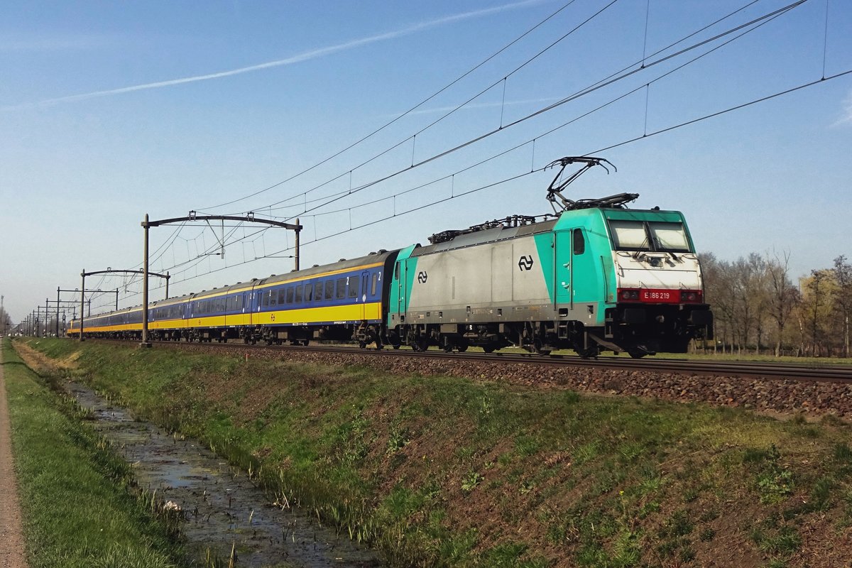 Alpha Trains 186 219 hauls an IC to Eindhoven through Boxtel on 30 March 2021.