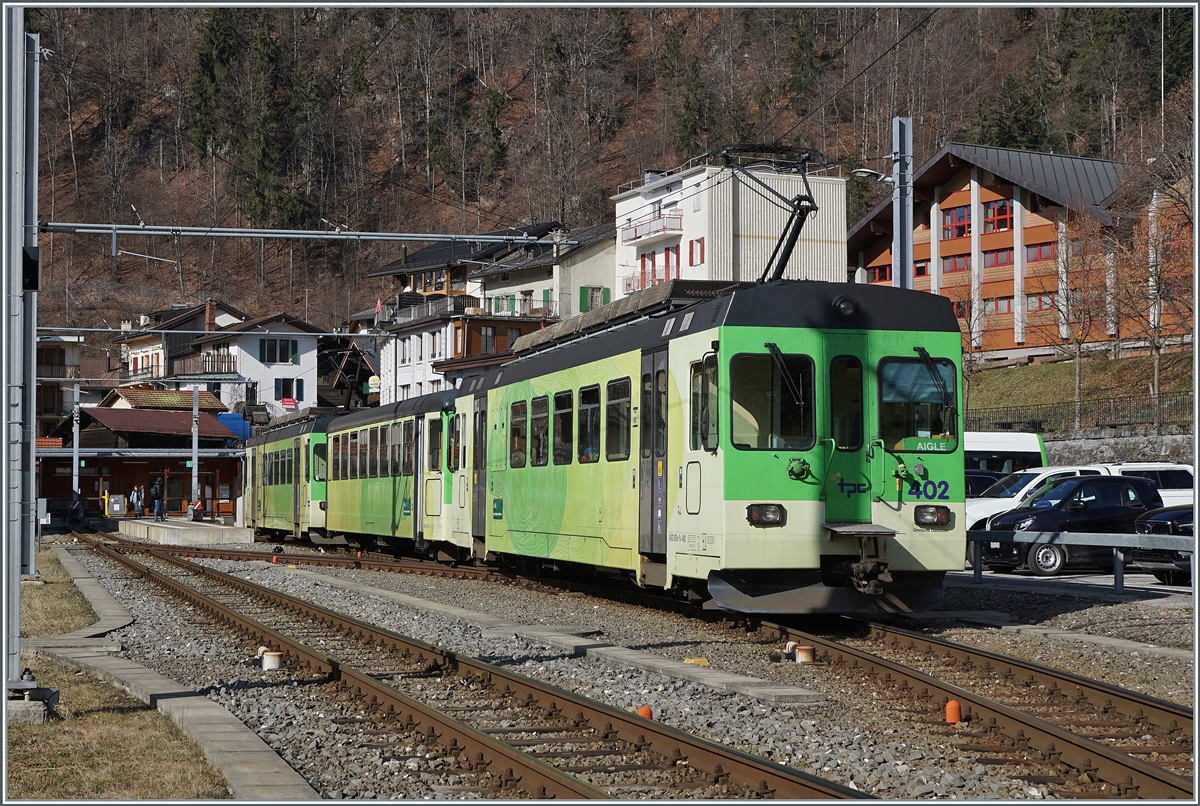 An ASD/TPC regional train, consisting of the ASD BDe 4/4 402 a Bt and another BDe 4/4 at the head of the train, is traveling from Les Diablerets to Aigle and reaches the small Le Sépey terminus station. Feb 17, 2024
